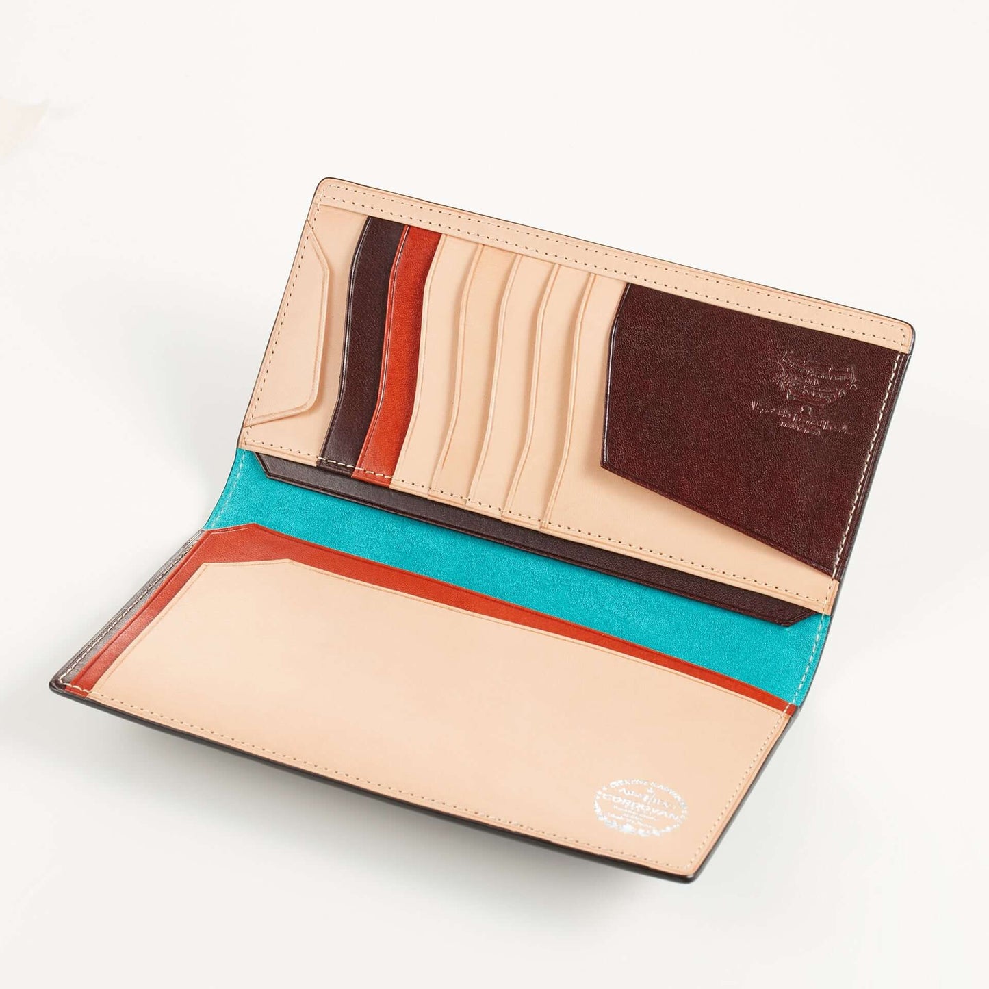 Open non-stitch cordovan long wallet showcasing multiple card slots and spacious compartments.